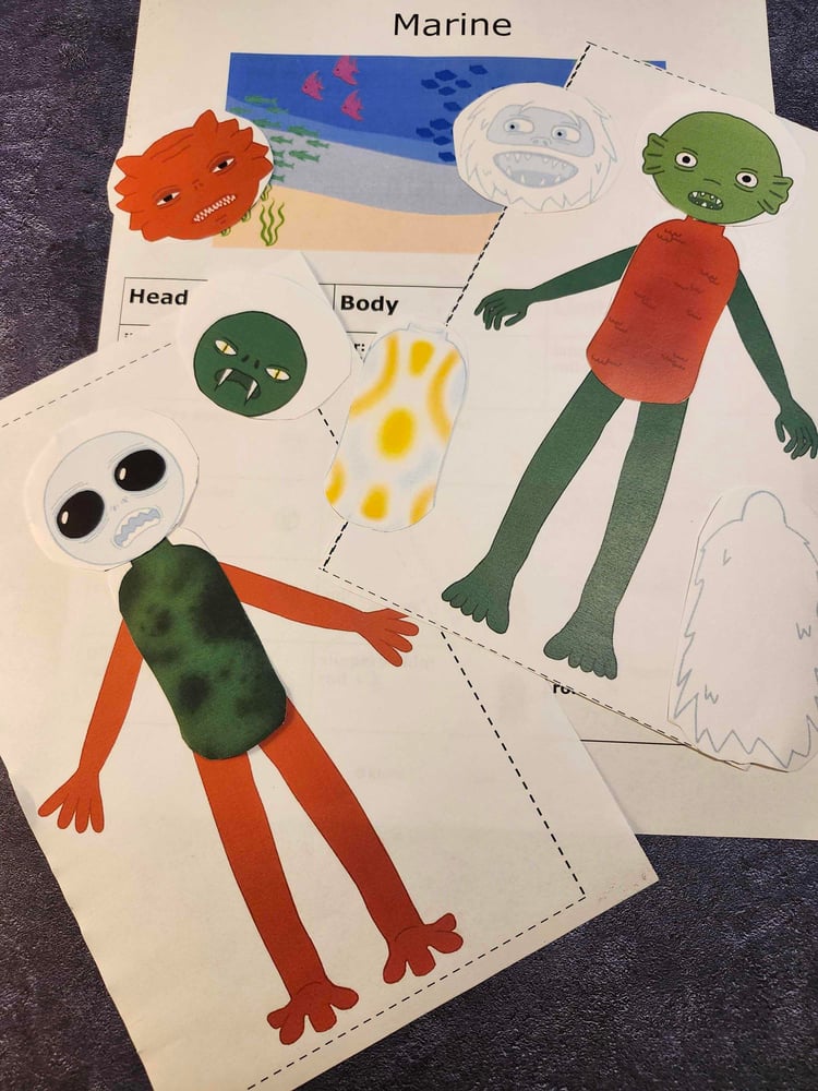 Student-made monsters from Monster Mix and Match on a marine biome sheet