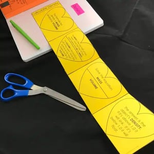 A photo of the paper INB, cut out and glued into a notebook. This INB is a long strip that can be neatly folded into a square. Each square on the INB informatively walks students through the process of solve for an object's density.